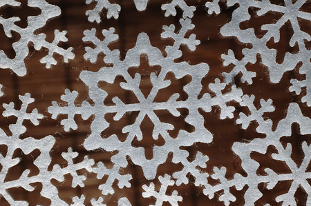 The shape of snow flakes on a blurred background.の写真素材