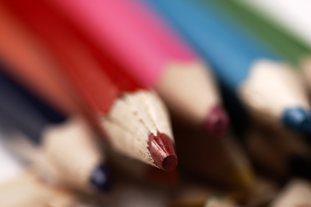 Colorful wooden pencils. Selective focus. Artistic mess on the table.の写真素材