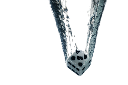 Dice game under the water. Visible splash and air bubbles.の写真素材