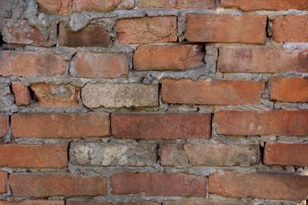 Old dilapidated red brick wall.の写真素材