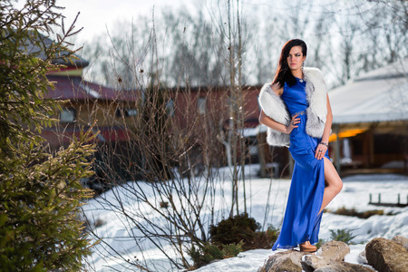 Beautiful young girl in a fur sleeveless jacketの写真素材