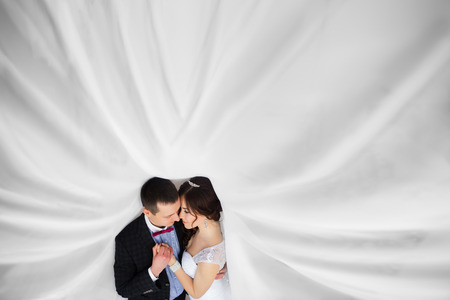 Just married under a veil caressの写真素材
