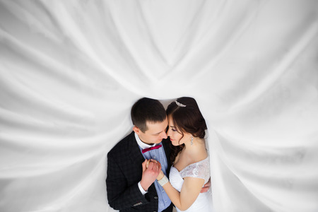 Just married under a veil caressの写真素材