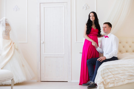 The girl in a pink dress and guy in the butterfly room for honeymoonersの写真素材