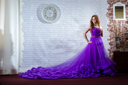 Lady in a luxury, long purple dressの写真素材