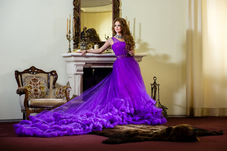 Woman in a luxury, long purple dressの写真素材