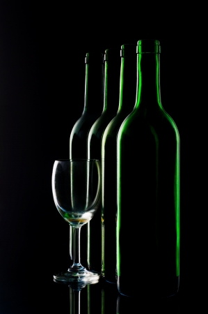 Bottles of wine on black background の写真素材