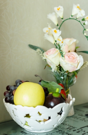 beautiful still life wite white roses and fruitの写真素材
