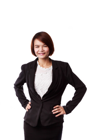 Asian business woman in suit smiling isolated on whiteの写真素材