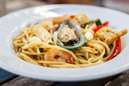 Spaghetti spicy seafood on plateの写真素材