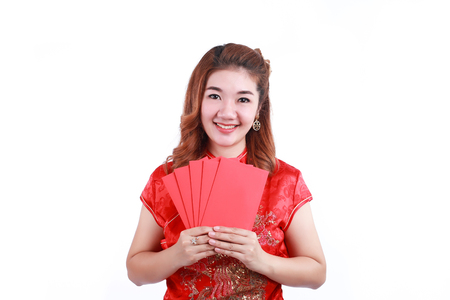 Happy chinese new year. smiling asian woman holding red envelopeの写真素材