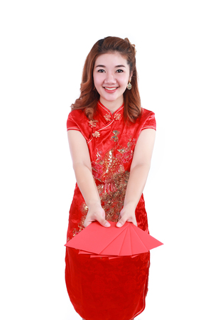 Happy chinese new year. smiling asian woman holding red envelopeの写真素材