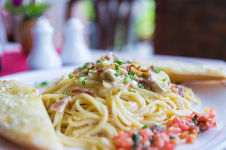 spaghetti carbonara with ham and cheeseの写真素材