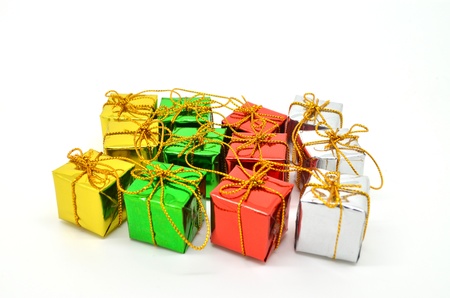 Colored and decorated shining gift boxes with golden ribbon and bow.