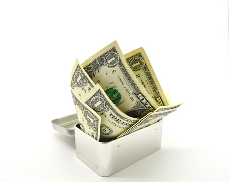 a one-dollar bank note in a metal box isolated on white backgroundの写真素材