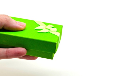 hand holding a green gift boxの写真素材