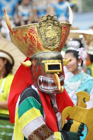 LOEI PROVINCE,THAILAND-JUNE 23:Unidentified men wear ghost costumes at Ghost Festival (Phi Ta Khon - a masked procession celebrated by Buddhist) at Dan Sai district in Loei Province on July 23, 2012. のeditorial素材