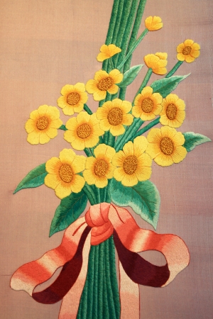 Vintage embroidery on hand made flower color yellow on fabricのeditorial素材