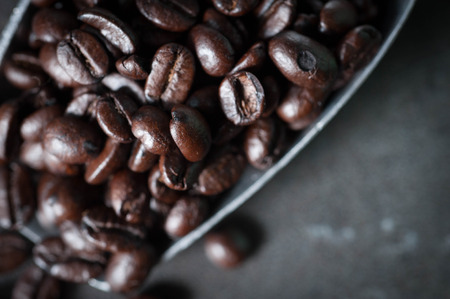 Coffee bean on black stone background