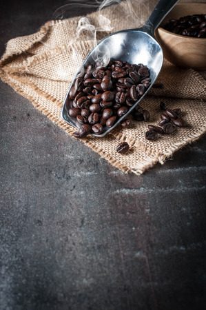 Coffee bean on black stone backgroundの写真素材