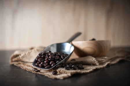 Coffee bean on black stone backgroundの写真素材