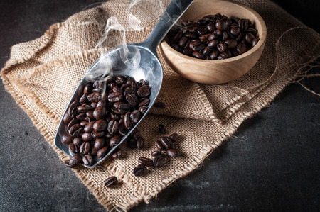 Coffee bean on black stone backgroundの写真素材