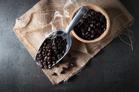 Coffee bean on black stone backgroundの写真素材