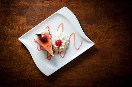 Strawberry cheesecake on wooden backgroundの写真素材