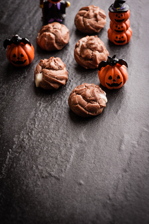 Eclairs with halloween decoration on black backgroundの写真素材