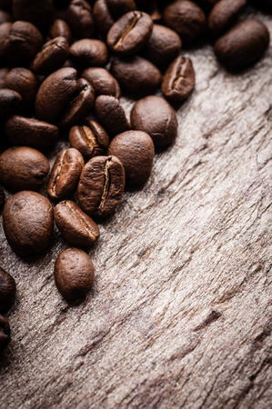 Coffee beans on grunge stone backgroundの写真素材