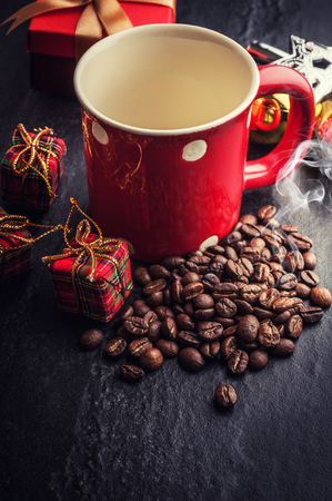 Red mug and Christmas tree with decoration on dark stone backgroundの写真素材