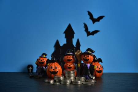 Halloween pumpkins jack-o-lantern on dark blue background. Halloween pumpkin background. Happy Halloween. の写真素材