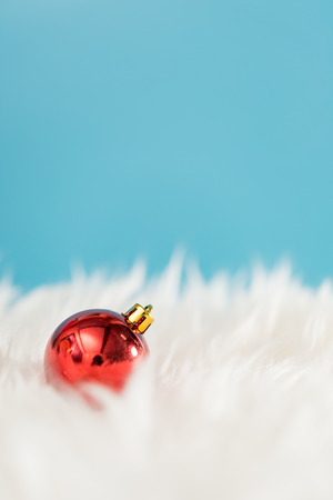 Christmas background with a red ornament gift box and fir in snow.の写真素材