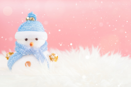 Happy snowman standing in winter christmas snow background. Merry christmas and happy new year greeting card with copy-space. Christmas celebration holiday background.の写真素材