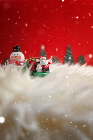 Christmas holiday background with Santa and decorations. Christmas landscape with gifts and snow. Merry christmas and happy new year greeting card with copy-space. Christmas celebration holiday background.の写真素材