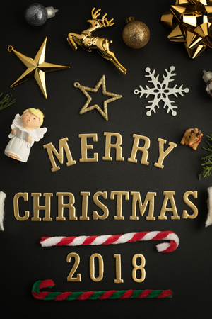 Christmas holiday background with gold ornaments and decorations. Merry christmas and happy new year greeting card with copy space. Christmas celebration holiday background.の写真素材