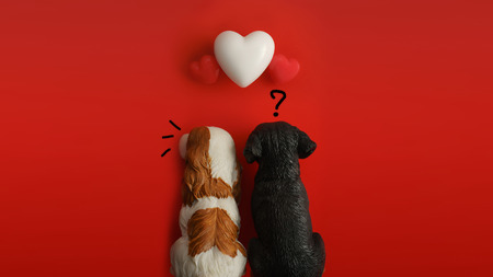 A sulky couple dog with flying hearts on red background with copy space. Symbol of love. Happy...