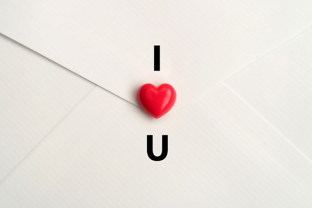 I LOVE YOU. Valentine's hearts on white envelope background with copy space. Symbol of love. Happy Valentines Day background concept.の写真素材