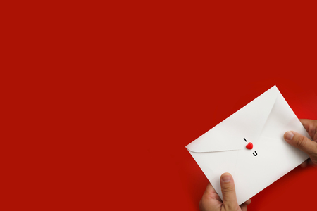 I LOVE YOU. Valentine's hearts on white envelope background with copy space. Symbol of love. Happy Valentines Day background concept.の写真素材