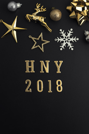 Happy new year 2018 holiday background with gold ornaments and decorations. Merry christmas and happy new year greeting card with copy space. New year celebration holiday background.の写真素材