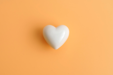 Valentine's hearts floating over color background with copy space. Symbol of love. Happy Valentines Day background concept.の写真素材