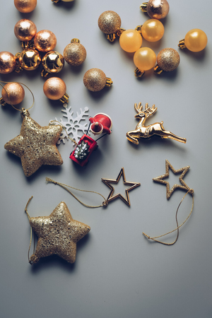 Christmas holiday background with gold ornaments and decorations. Merry christmas and happy new year greeting card with copy space. Christmas celebration holiday background.の写真素材