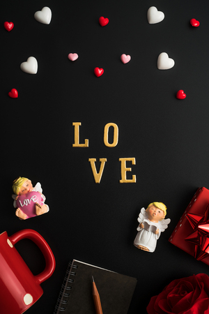 Flat view of valentines hearts and decoration on dark background with copy space. Symbol of love. Happy Valentines Day background.Saint Valentine's Day concept. Can be used for celebrations valentines day.の写真素材