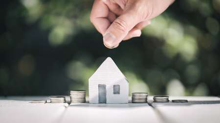 Saving to buy a house or home savings concept with money coin stack growing.Saving money concept.の写真素材
