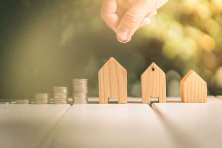 Saving to buy a house or home savings concept with money coin stack growing.Saving money concept.の写真素材