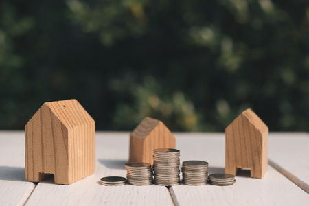 Saving to buy a house or home savings concept with money coin stack growing.Saving money concept.の写真素材