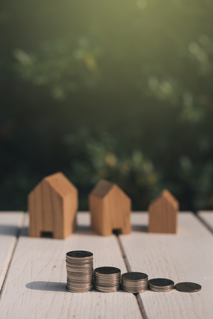 Saving to buy a house or home savings concept with money coin stack growing.Saving money concept.の写真素材