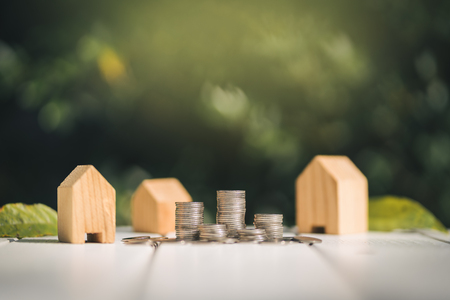 Saving to buy a house or home savings concept with money coin stack growing.Saving money concept.の写真素材