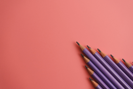 purple pencils on pink background with copy space. Back to school and Education Concept.の写真素材