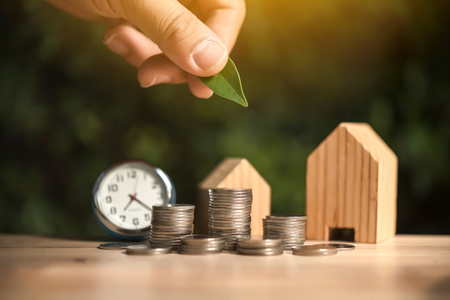 Saving to buy a house or home savings concept with money coin stack growing.Saving money concept.の写真素材